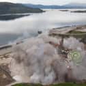 Striking footage shows a decommissioned oil rig being demolished with a controlled explosion, at Kishorn Port Limited's dry dock facility in Strathcarron, Wester Ross, Scotland