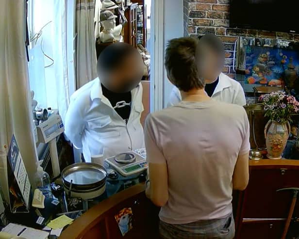 CCTV captures a couple allegedly leaving with cash after conning a pawnbroker with an audacious fake gold swap. 