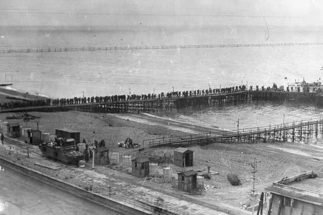 British troops on temporary piers alongside South Parade Pier. They are about to board an LCI(L) or Landing Craft, Infantry (Large) to take them to Normandy: it can be seen in the distance at the end of the pier.