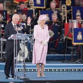 King Charles III and Queen Camilla on stage