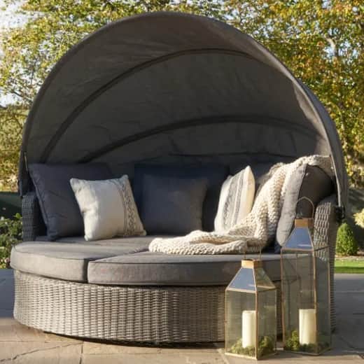 The 'luxury' option of a Bermuda Rattan Outdoor Day Bed that is in the Dunelm sale