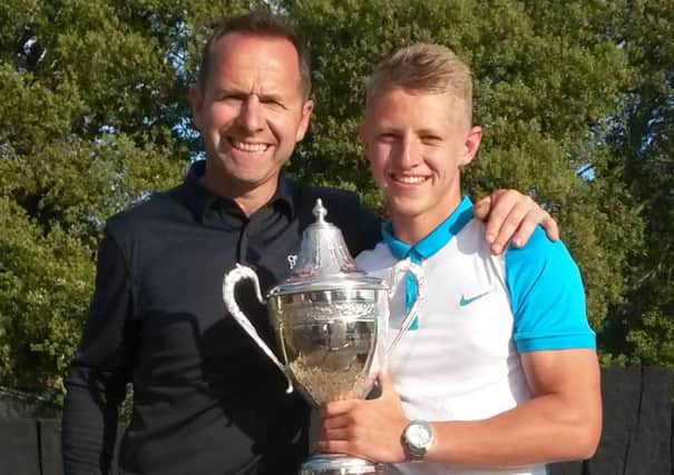 Stanley Garland, right, celebrates after regaining his Gosport & Stokes Bay Golf Club Championship title with dad Pete Garland