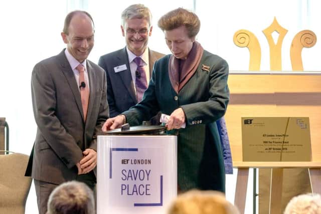 HRH The Princess Royal seals the IET capsule with past IET President Dr William Webb and current president Jeremy Watson